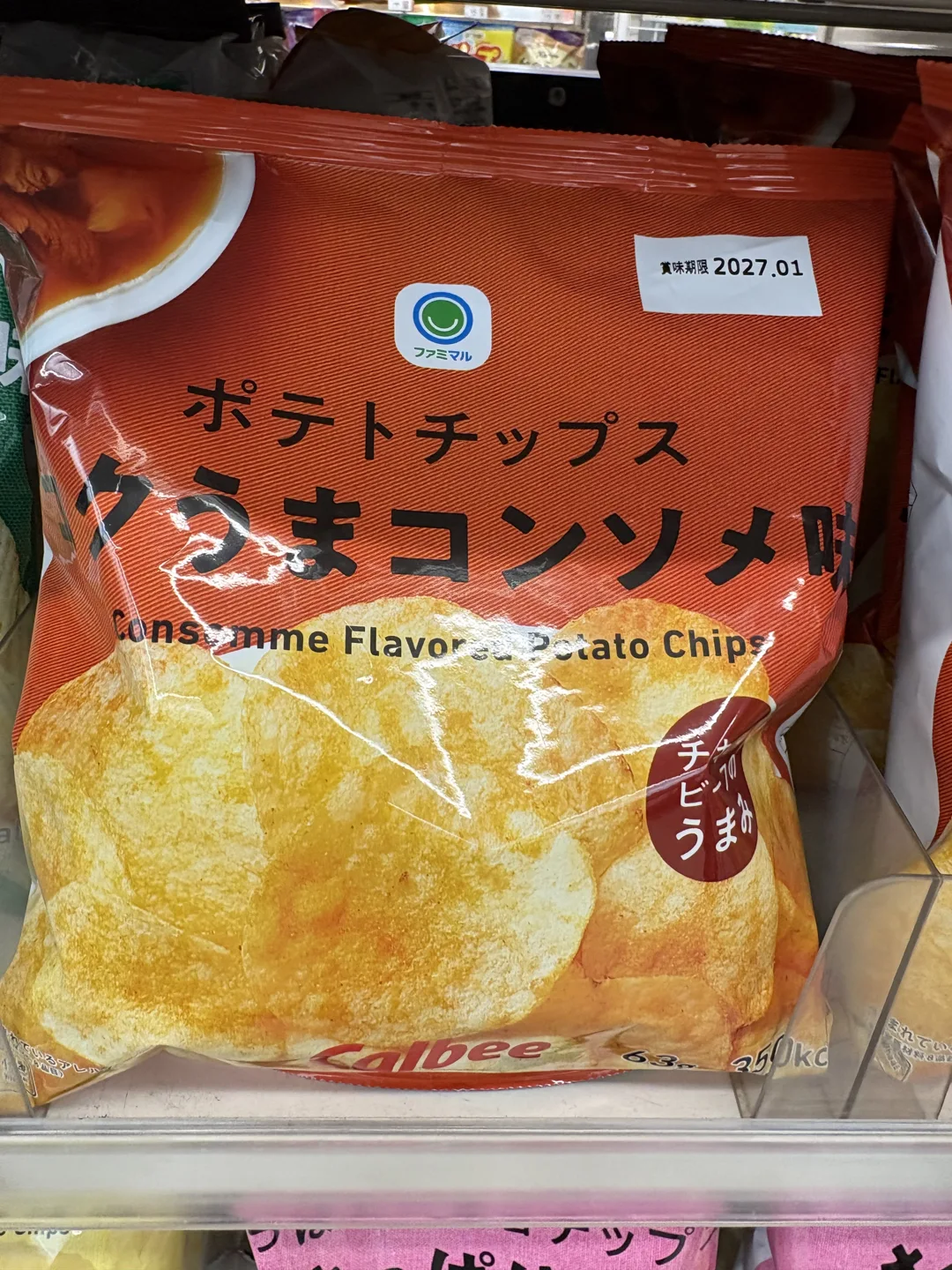 Orange 63 gram bag of Famimaru consommé-flavored potato chips on a shelf