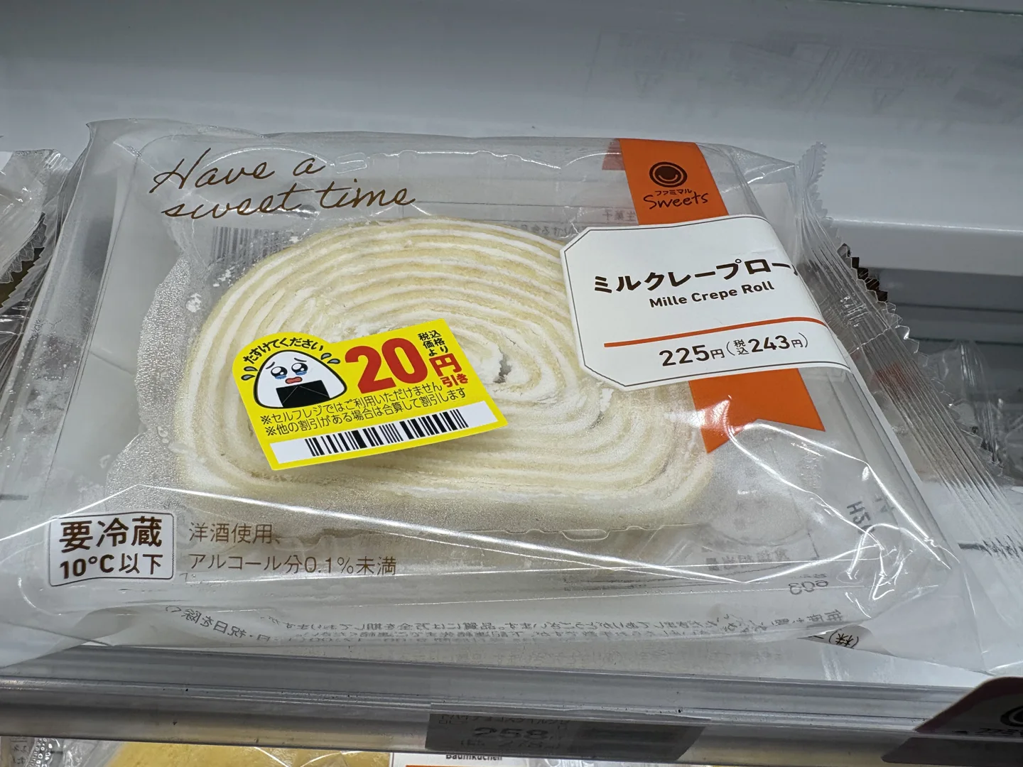 Mille Crepe Roll showing cream layers, a 243 yen regular price and a 20 yen discount sticker